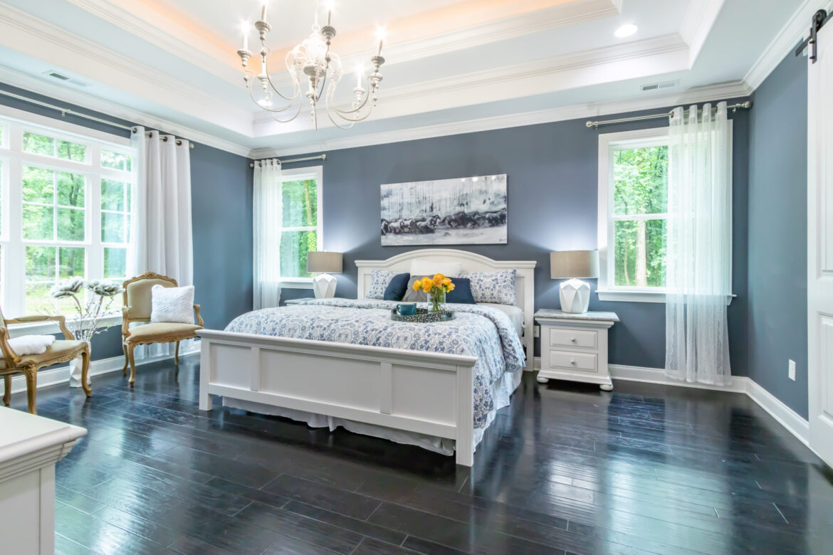 Beautiful interior design of bedroom with painted light grey walls - article decoding common paint terms.