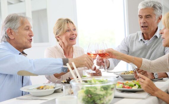 Four senior citizens having dinner